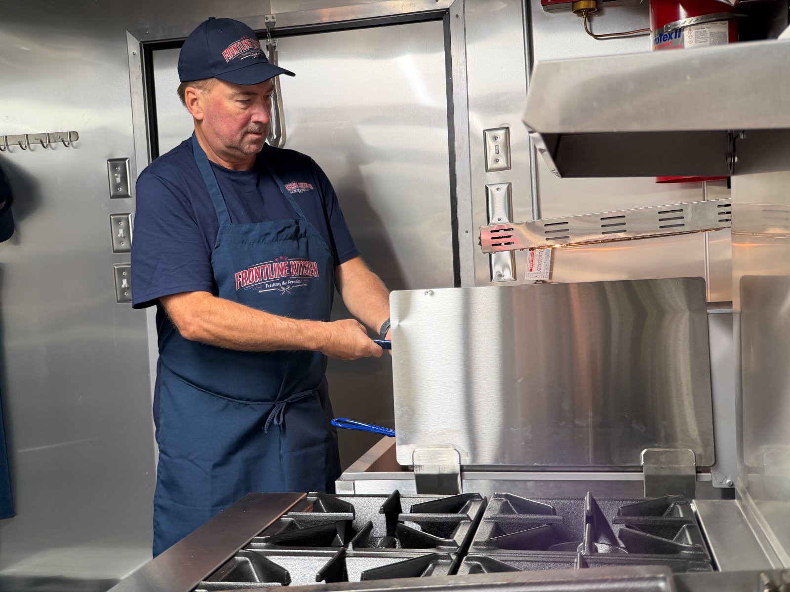 Crew working the griddle on deployment